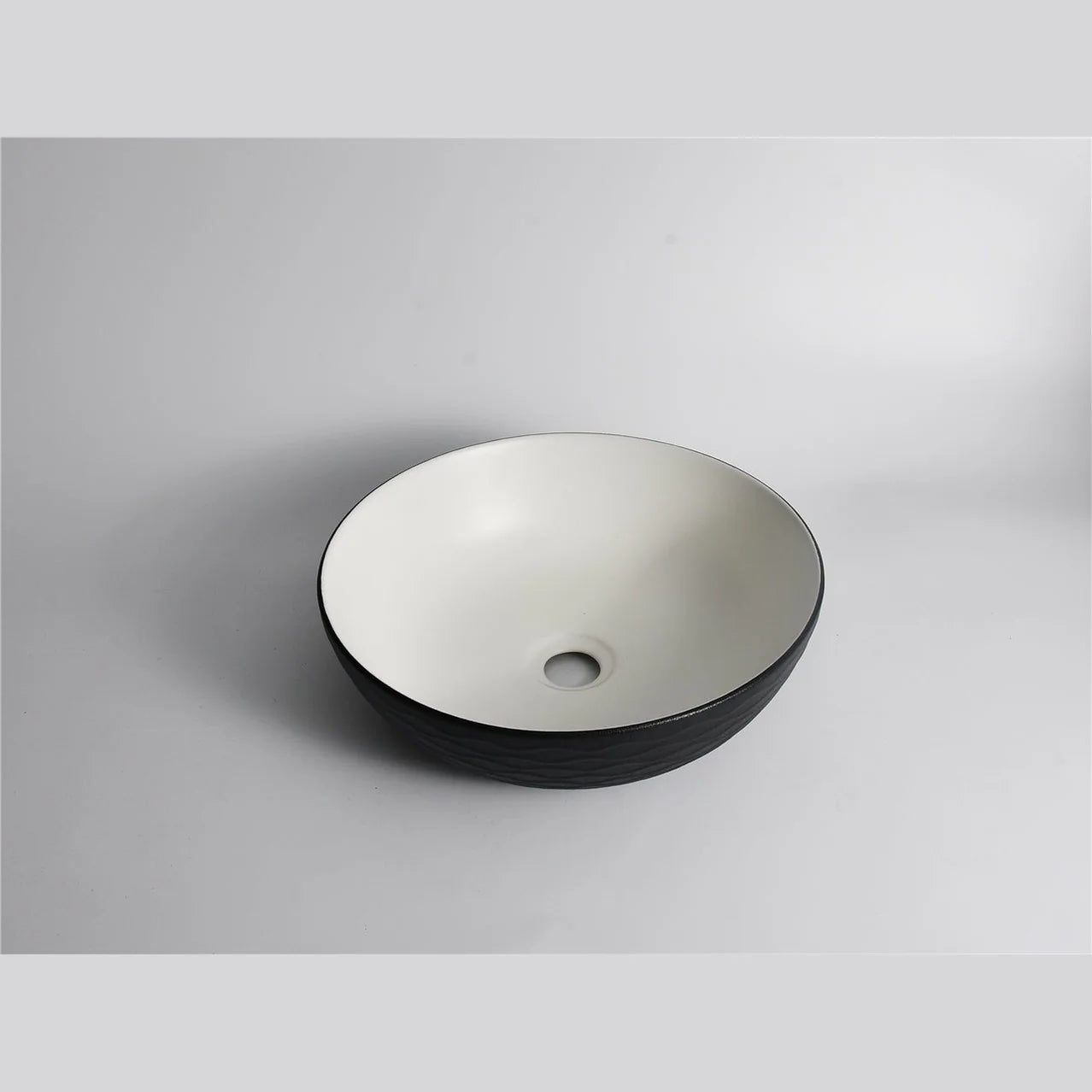 Claya above-counter ceramic basin - P-Wavy-40-TMB